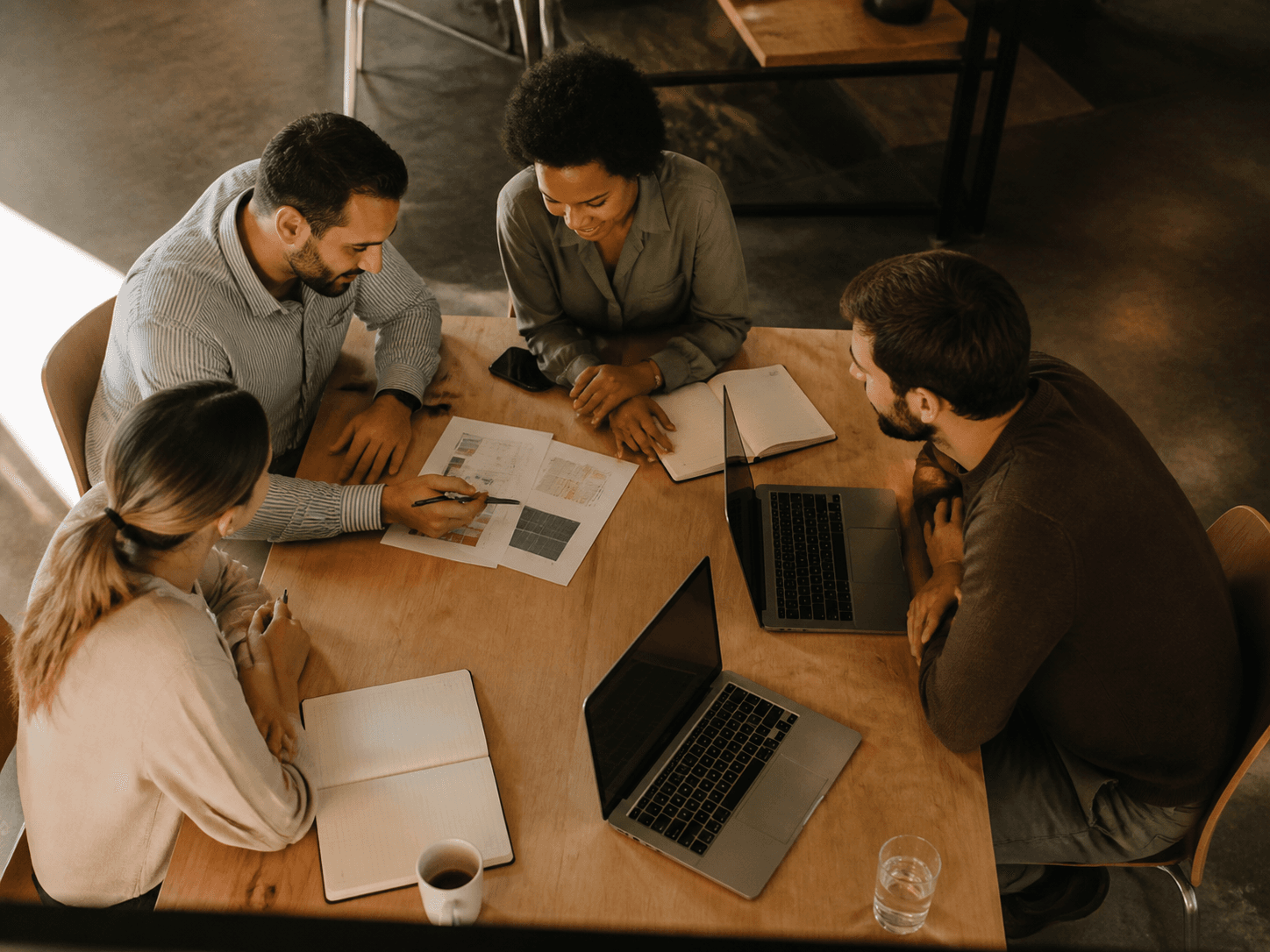 Small team reviewing business documents together